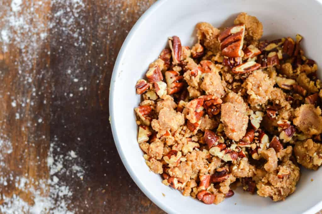 Pecan crumble topping in white bowl